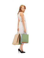 Image showing happy teenage girl with shopping bags
