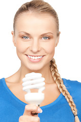 Image showing woman holding energy saving bulb