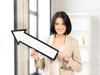 Image showing businesswoman with direction arrow sign