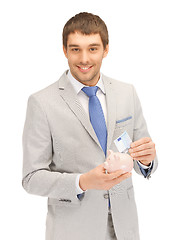 Image showing man with piggy bank and money