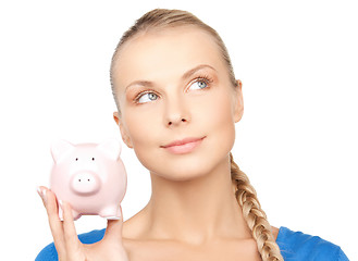 Image showing lovely woman with piggy bank