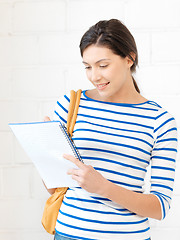 Image showing happy woman with big notepad