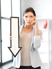 Image showing businesswoman with direction arrow sign