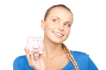 Image showing lovely woman with piggy bank