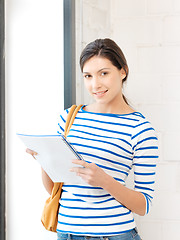 Image showing happy woman with big notepad