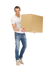 Image showing handsome man with big box