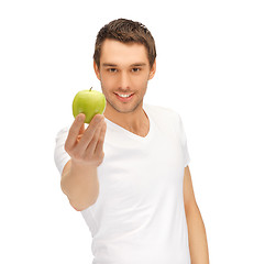 Image showing man in white shirt with green apple