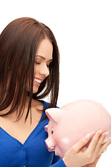 Image showing lovely woman with piggy bank