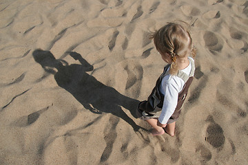 Image showing child and shadow in sand