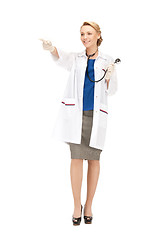 Image showing attractive female doctor pointing her finger