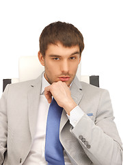 Image showing young businessman sitting in chair