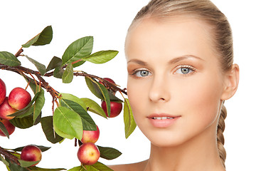 Image showing lovely woman with apple twig