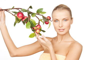 Image showing lovely woman with apple twig