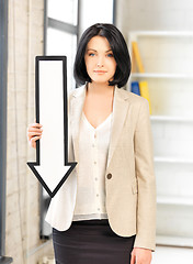 Image showing businesswoman with direction arrow sign