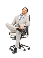 Image showing young businessman sitting in chair