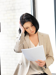 Image showing calm woman with documents