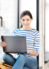 Image showing happy teenage girl with laptop computer