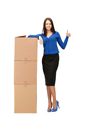 Image showing attractive businesswoman with big boxes