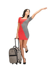 Image showing hitch-hiking woman with suitcase