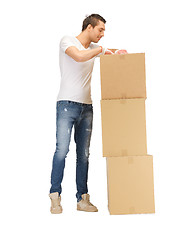 Image showing handsome man with big boxes