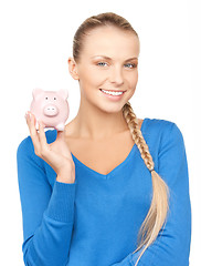 Image showing lovely woman with piggy bank