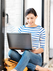 Image showing happy teenage girl with laptop computer