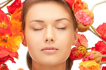 Image showing lovely woman with red flowers