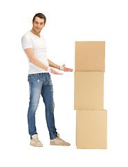 Image showing handsome man with big boxes