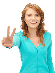 Image showing teenage girl showing victory sign