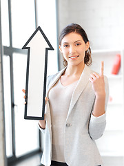 Image showing businesswoman with direction arrow sign