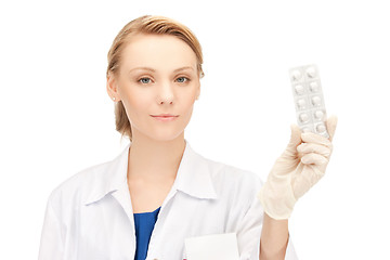 Image showing attractive female doctor with pills