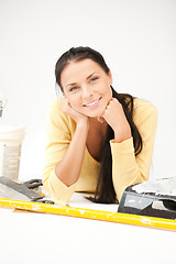 Image showing lovely housewife making repairing works