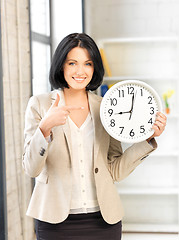 Image showing businesswoman with clock