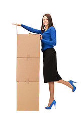 Image showing attractive businesswoman with big boxes