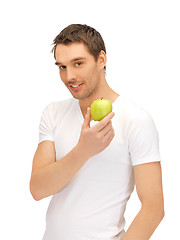 Image showing man in white shirt with green apple