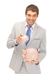 Image showing man with piggy bank