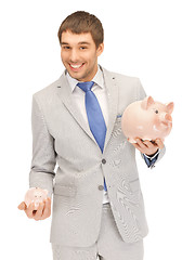 Image showing man with piggy bank