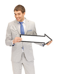 Image showing businessman with direction arrow sign