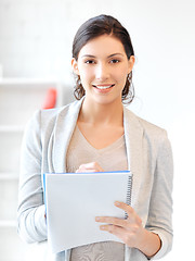 Image showing happy woman with big notepad