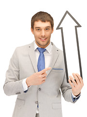 Image showing businessman with direction arrow sign