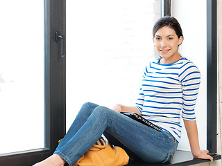 Image showing happy and smiling teenage girl with laptop