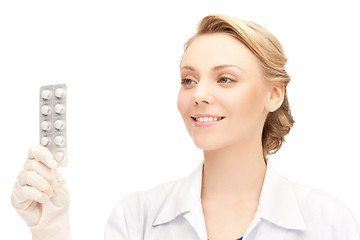 Image showing attractive female doctor with pills