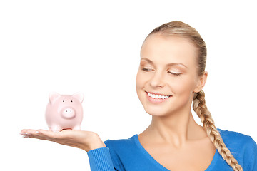 Image showing lovely woman with piggy bank