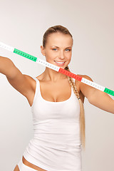 Image showing young beautiful woman with measure tape