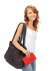 Image showing teenage girl in blank white t-shirt with book