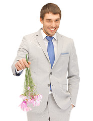 Image showing handsome man with flowers in hand