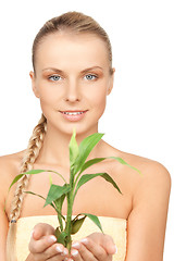 Image showing woman with green sprout