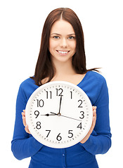 Image showing woman holding big clock