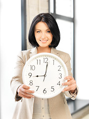 Image showing businesswoman with clock