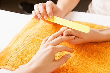 Image showing manicure process on female hands